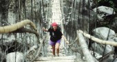 A precarious bridge over a glacier-fed river