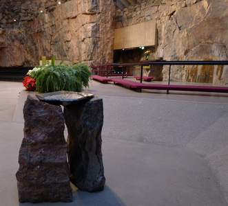 Inside Helsinki's Church in the Rock with its rough-hewn native rock walls
