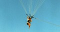 Parasailing-means-beign-connected-to-a-rope-controlled-by-a-ground-crew-Version-2