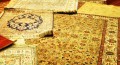 Turkish carpets are unrolled and piled for the customer to examine.