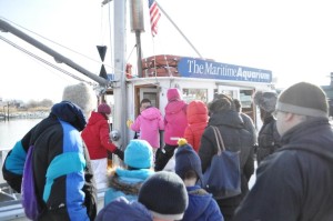 All bundled up for skiing... but we're getting on a boat.