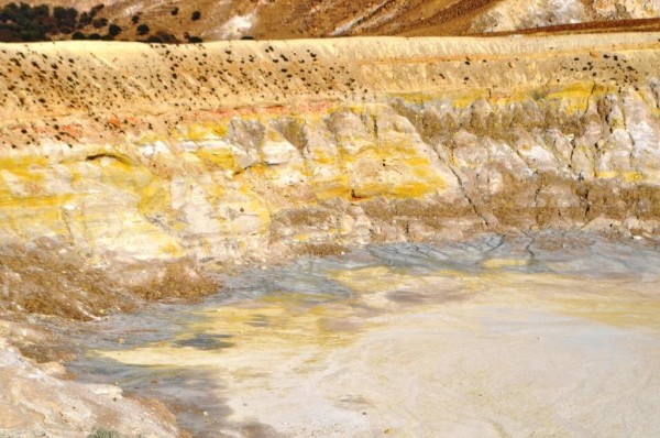 Steam vents and sulphur color the inside of this caldera on Nisyros. The island is still volcanically active, with steam vents in the caldera. 