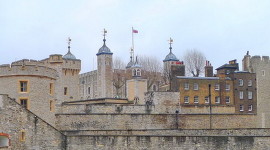Skyline of the Tower of London showing light coloured walls and many towers