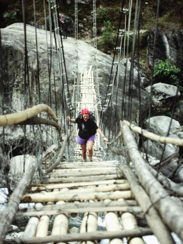 A precarious bridge over a glacier-fed river