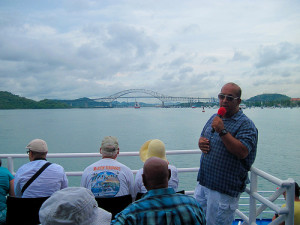 Tour guide explaining the entrance to the Panama Canal