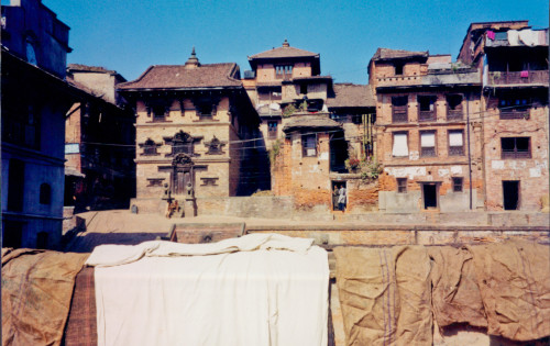 Laundry hung along the edge of a water tank